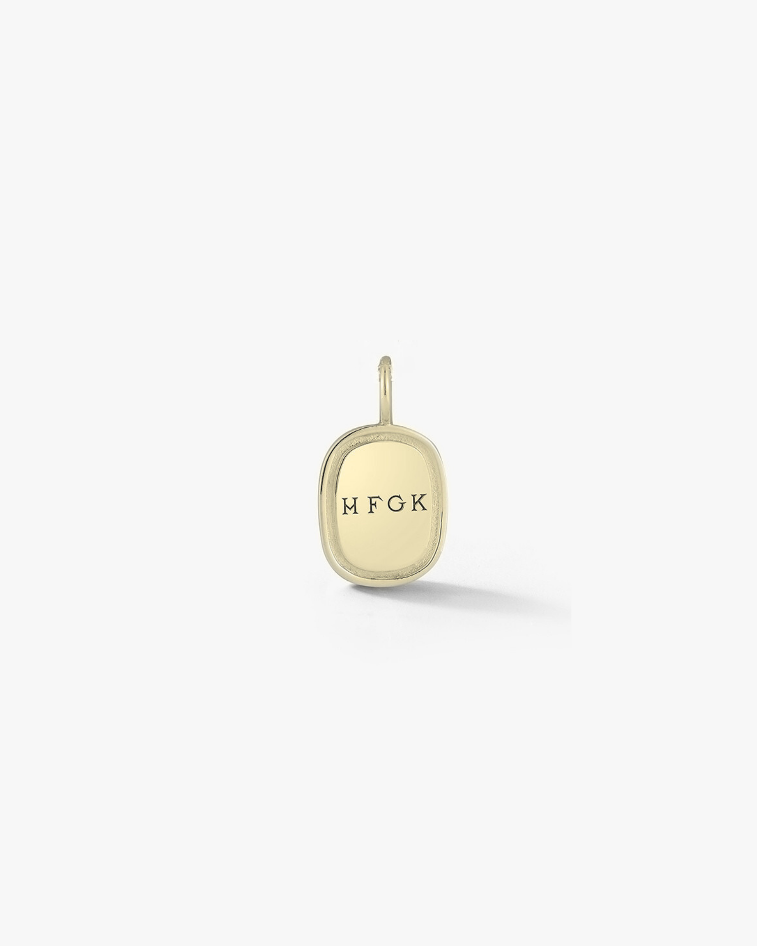 Gold oblong pendant with engraved letters "HFGK" on a white background. Made by Love Billy.