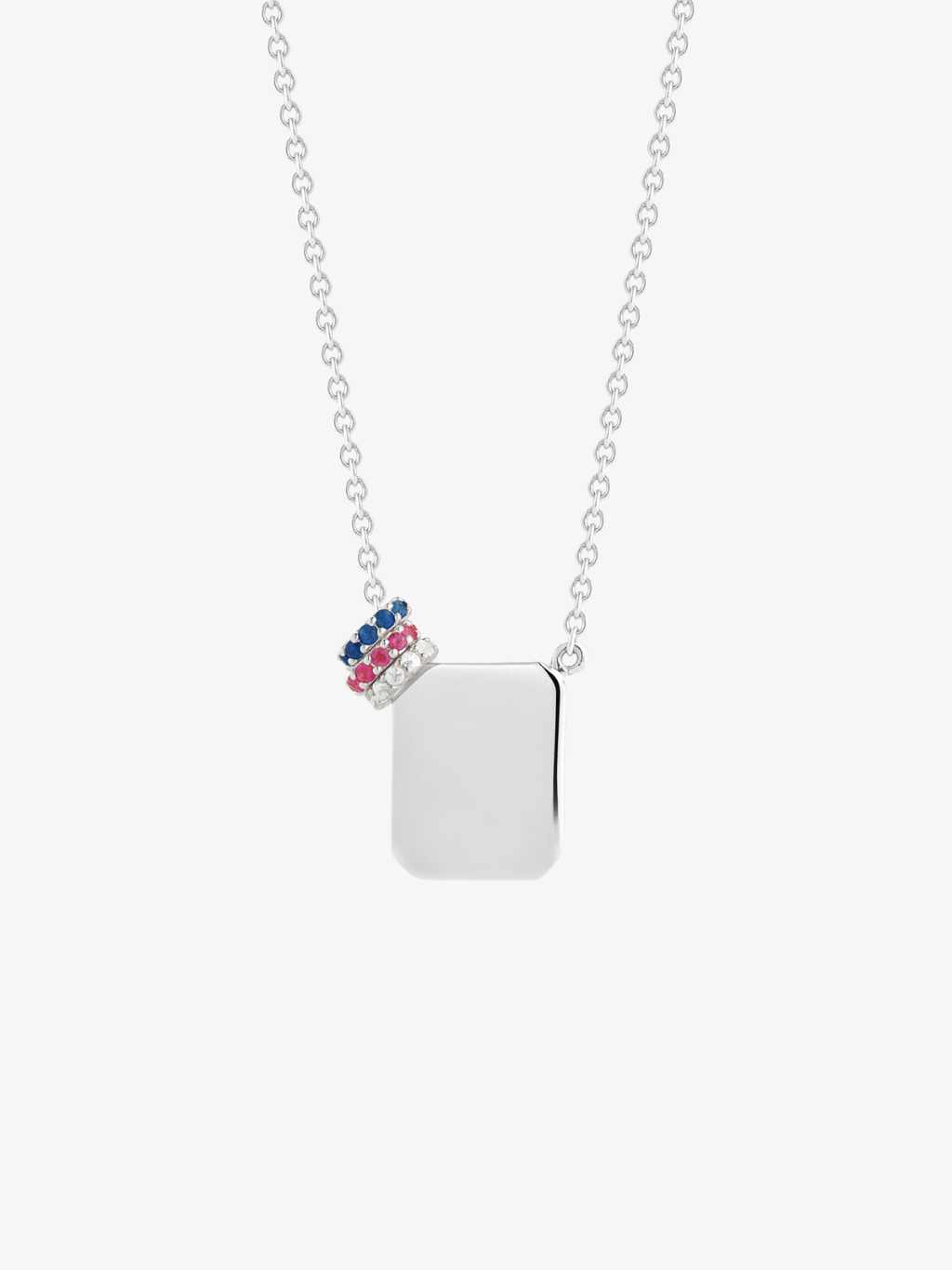 a silver tag necklace by love billy with a ruby halo charm, a diamond halo charm, and a sapphire halo charm.