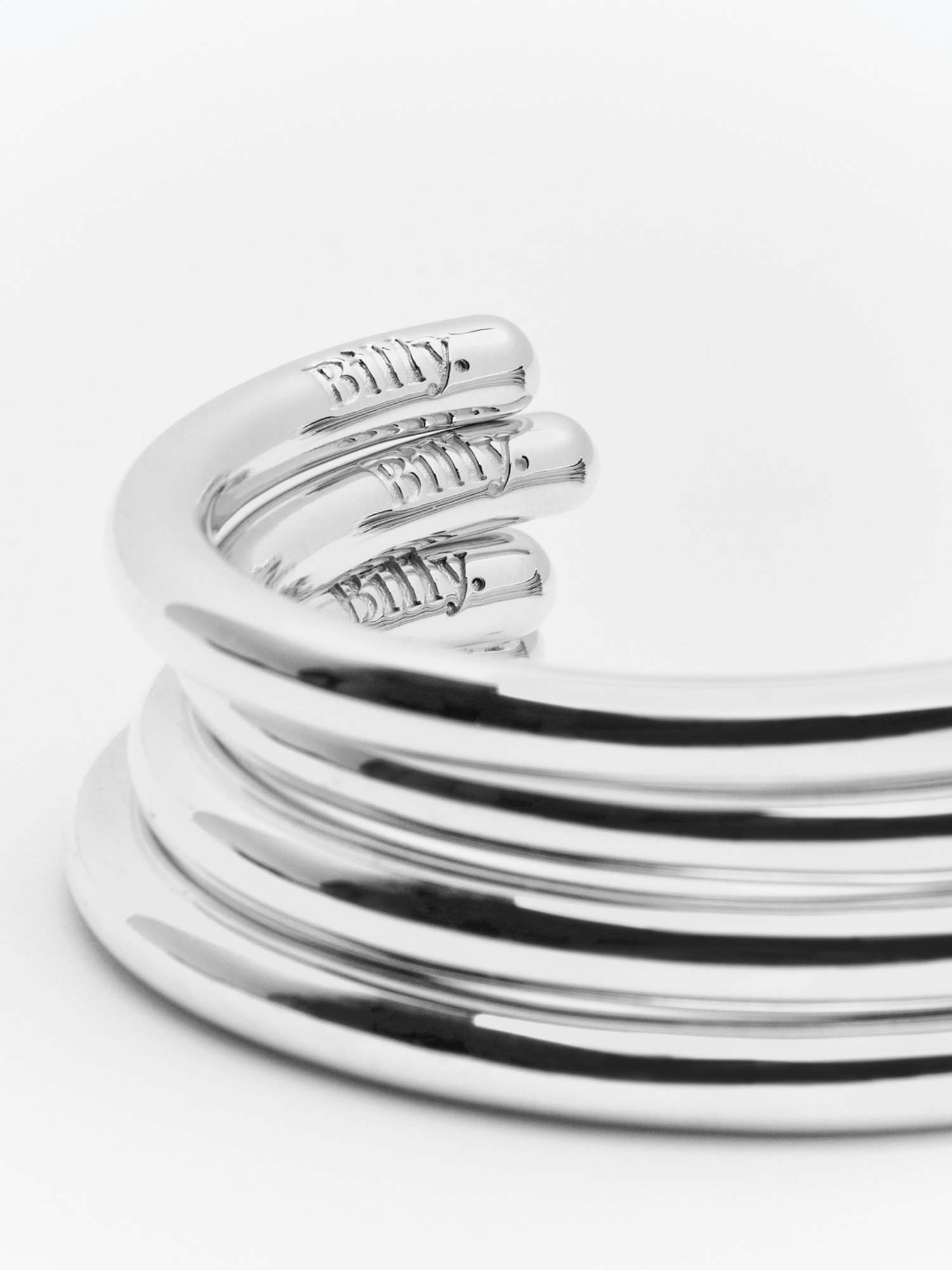 stack of sterling silver carousel cuffs by love billy.