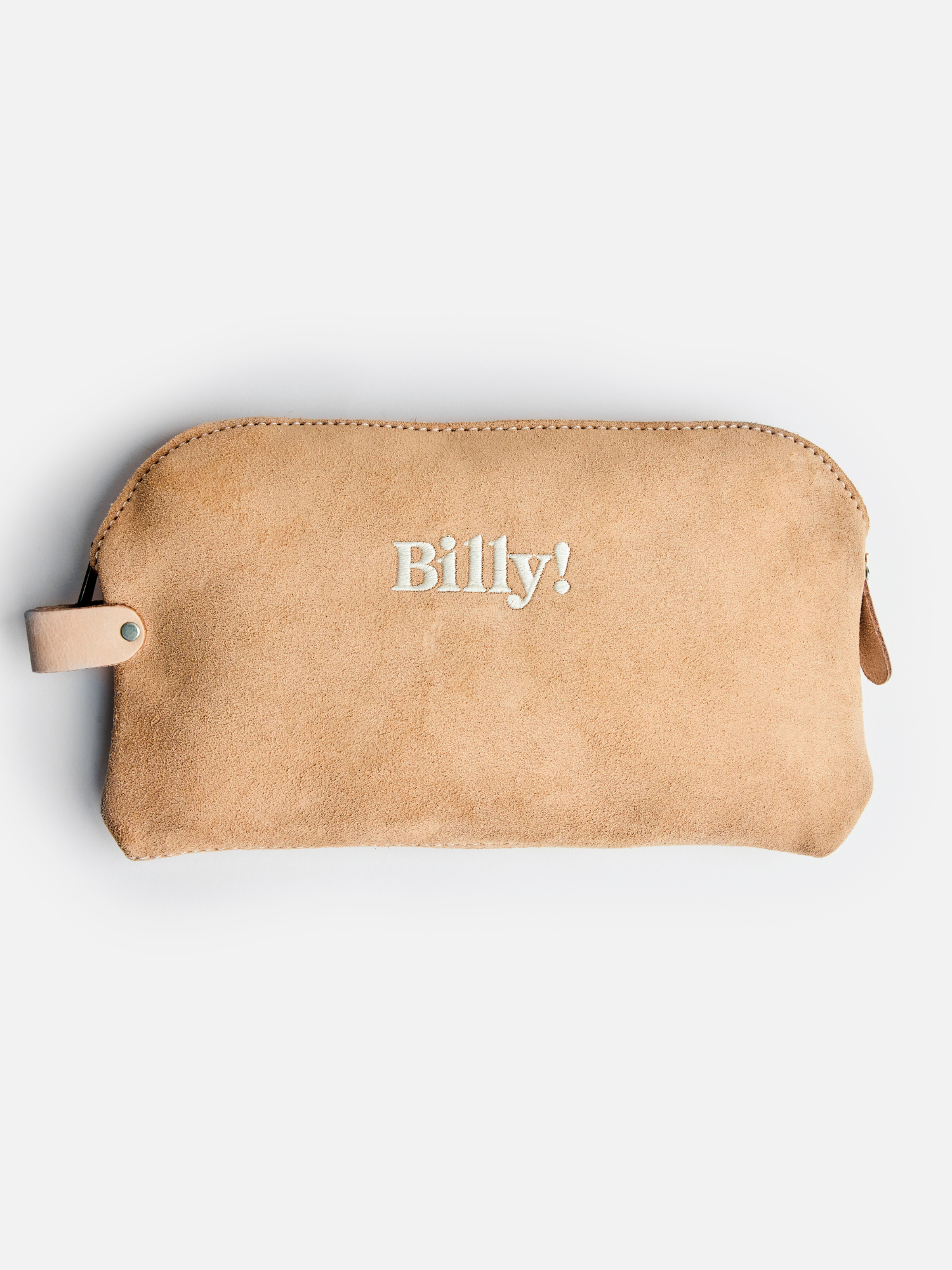 beige love billy suede pouch with Billy! embroidered in the middle of the pouch.