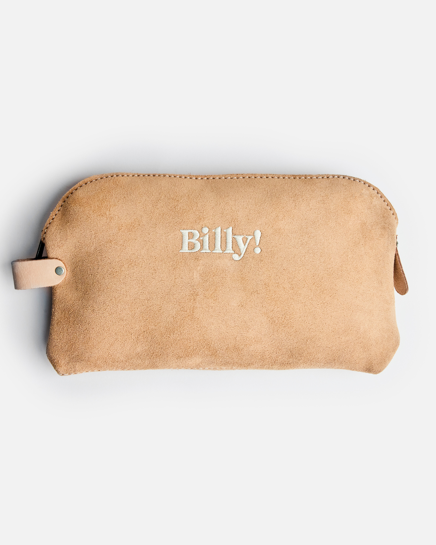beige love billy suede pouch with Billy! embroidered in the middle of the pouch.