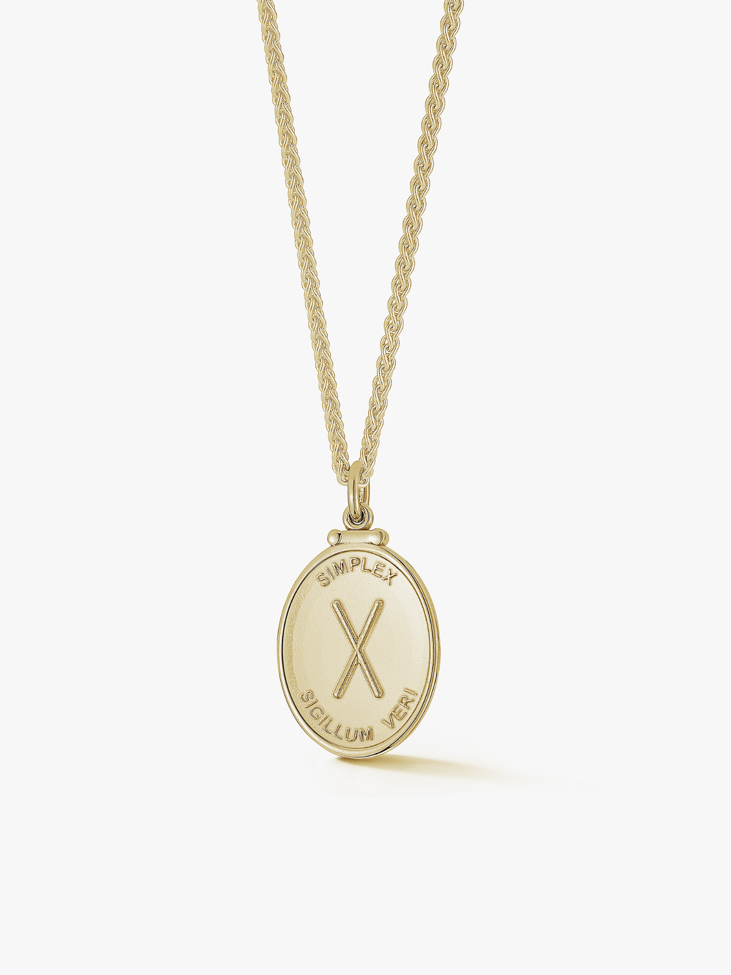14k gold medallion necklace.Engraved with Simplex sigillum veri which means simplicity is the sign of truth.
