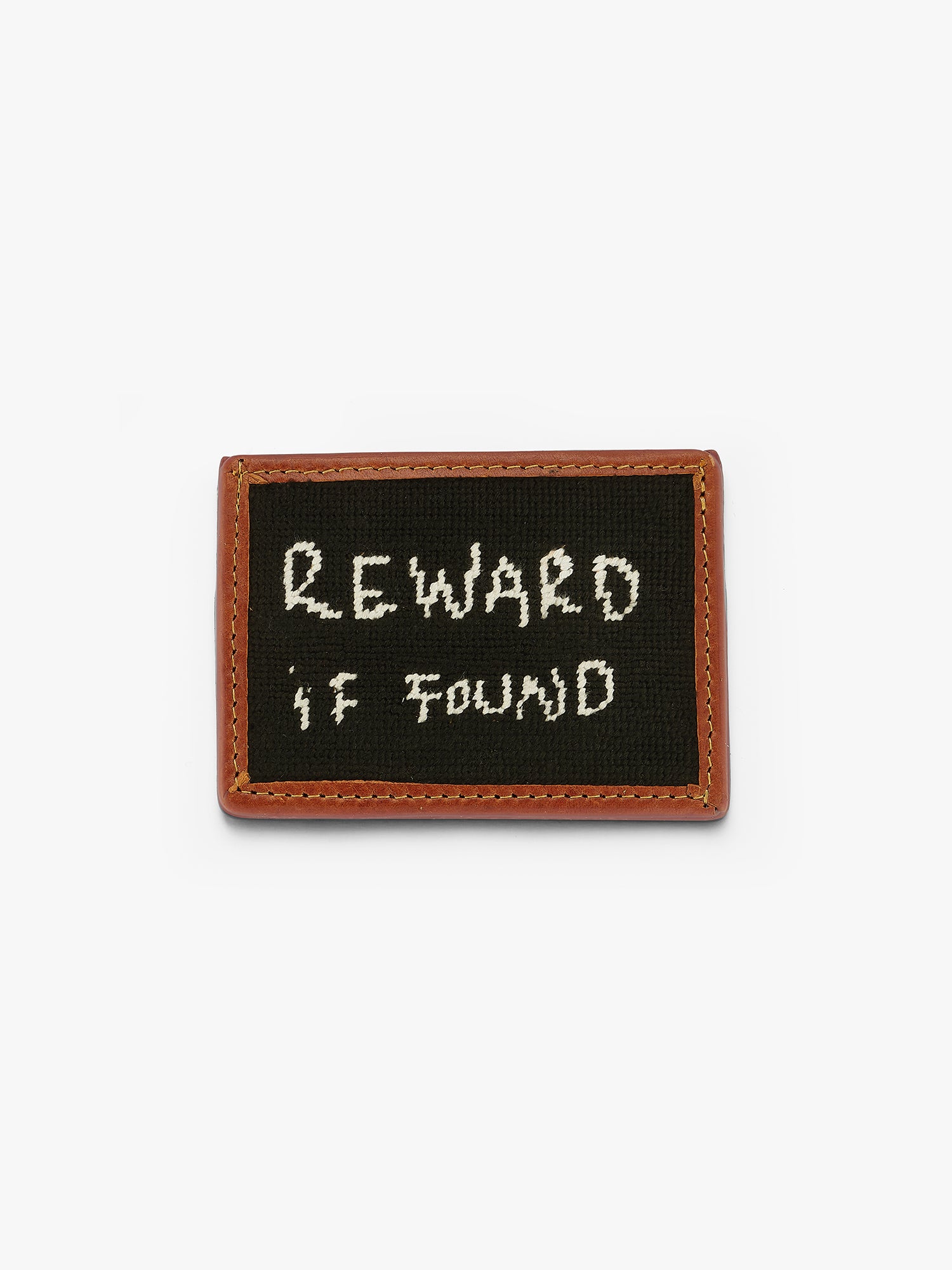 A Smathers & Branson custom engraved wallet reading "Reward if Found". Stitched by hand, vegetable dyed leather, 3 card slots and one center slot. Black engraving with white writing on brown leather. Love Billy.