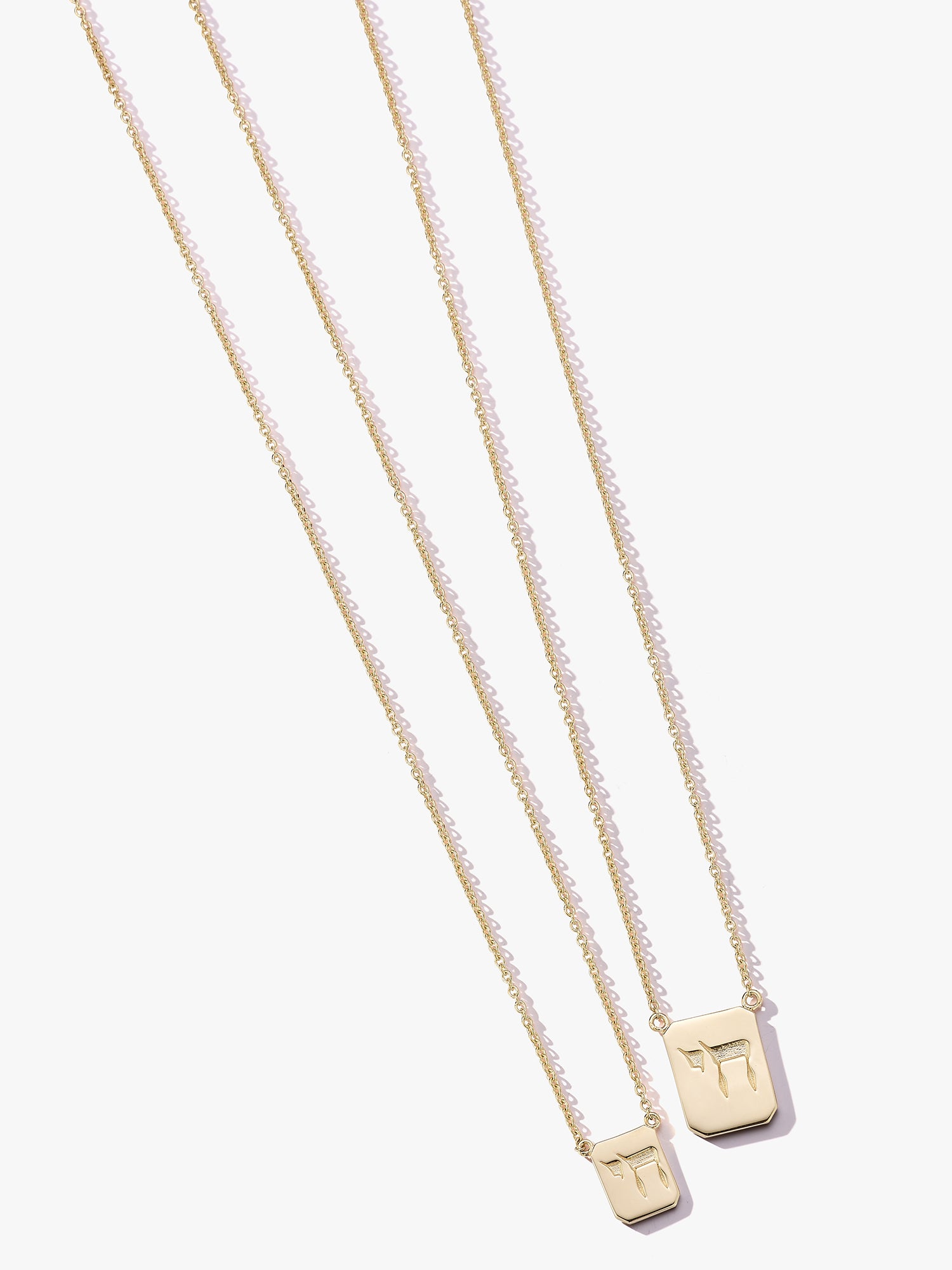 Personalized Love Billy Chai gold tag necklaces.