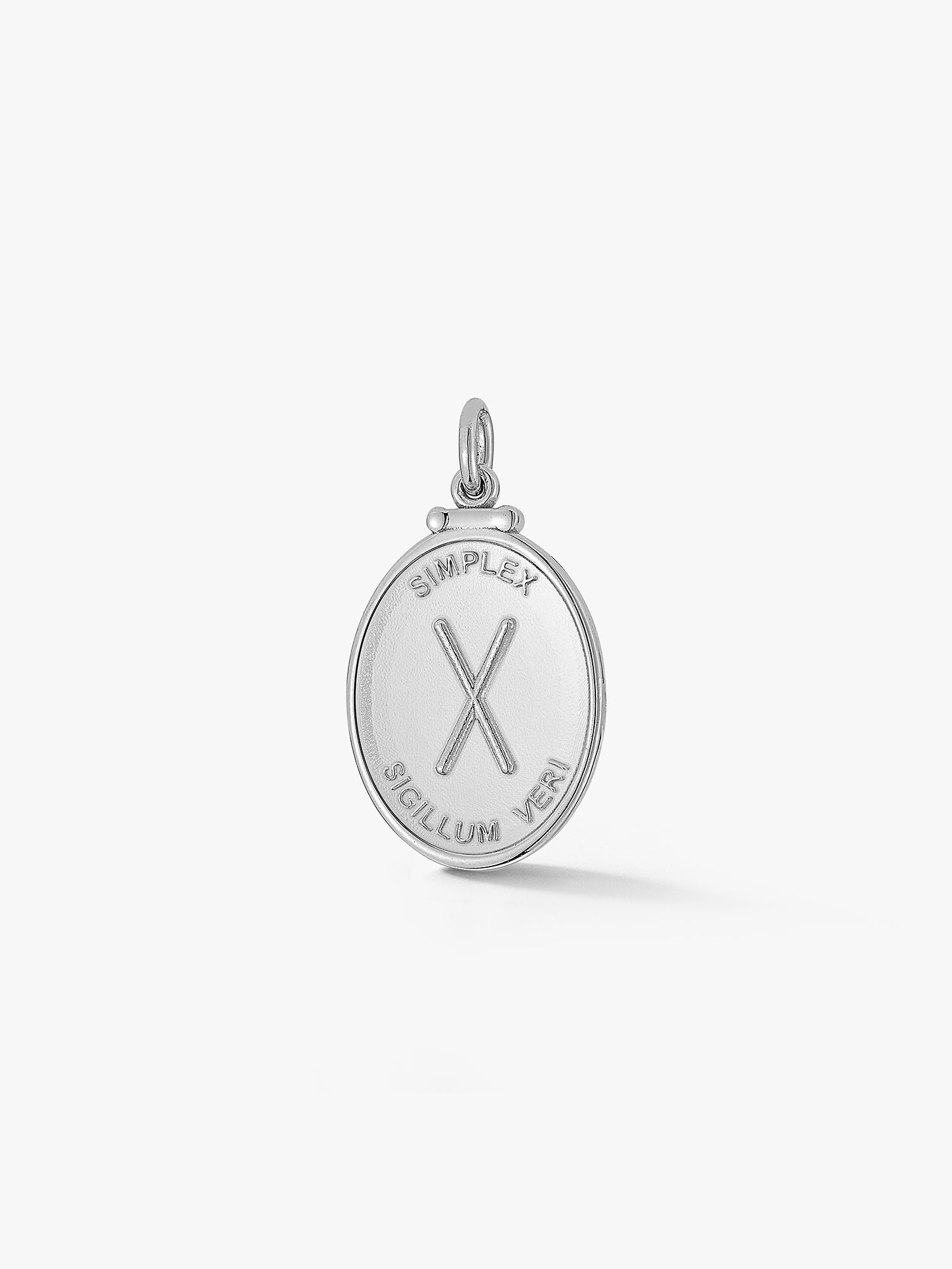 oval silver pendant with an X and latin phrase meaning simplicity is the sign of truth by love billy.