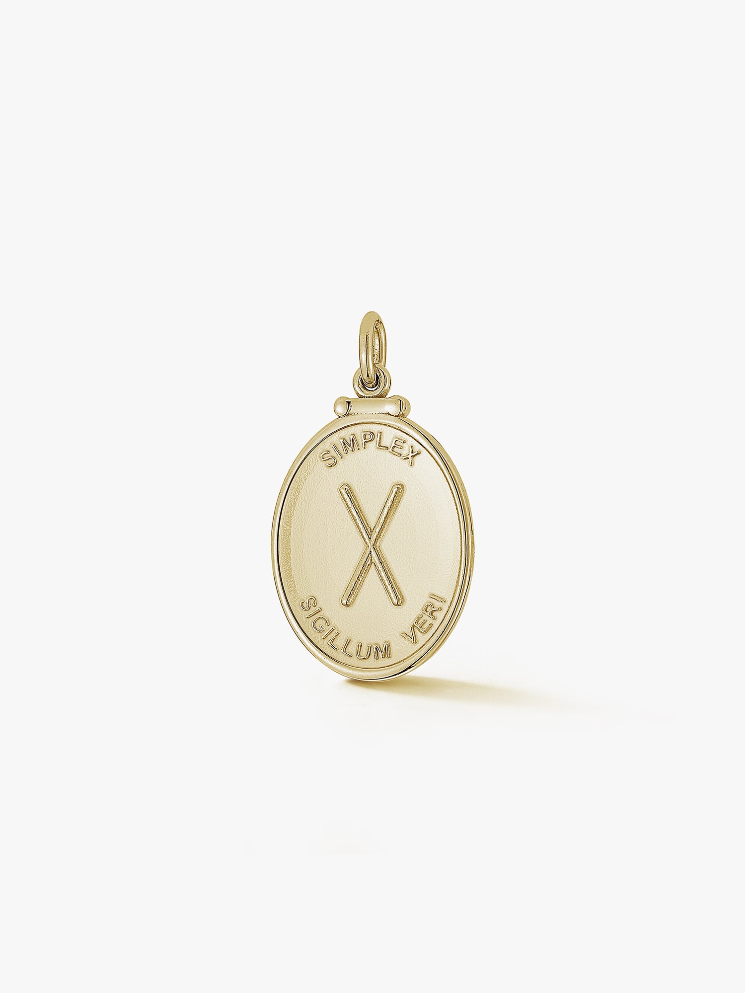oval gold pendant with an X and latin phrase meaning simplicity is the sign of truth by love billy.