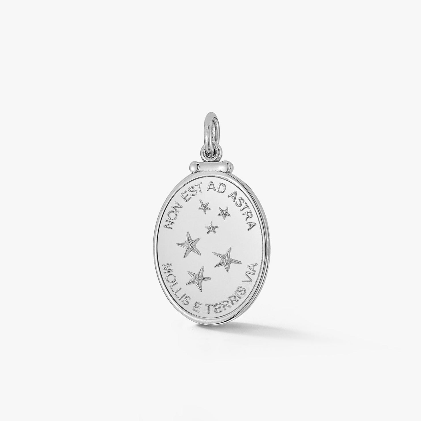 oval silver pendant with pattern of stars and latin phrase meaning the only way to the stars is from the earth by love billy.