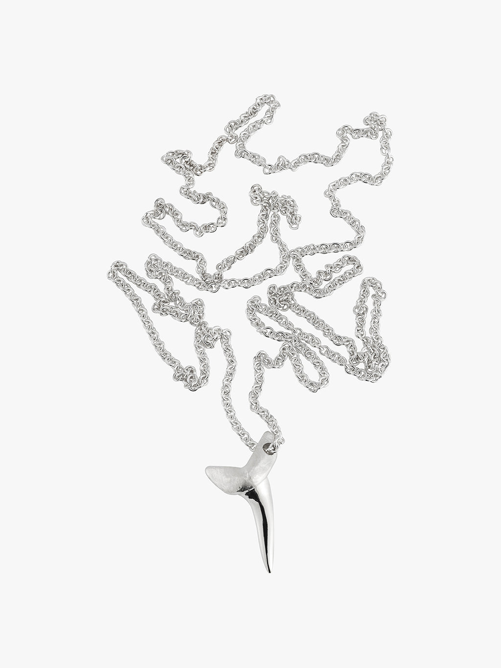 a bunched up silver shark tooth necklace by love billy on a wheat chain.