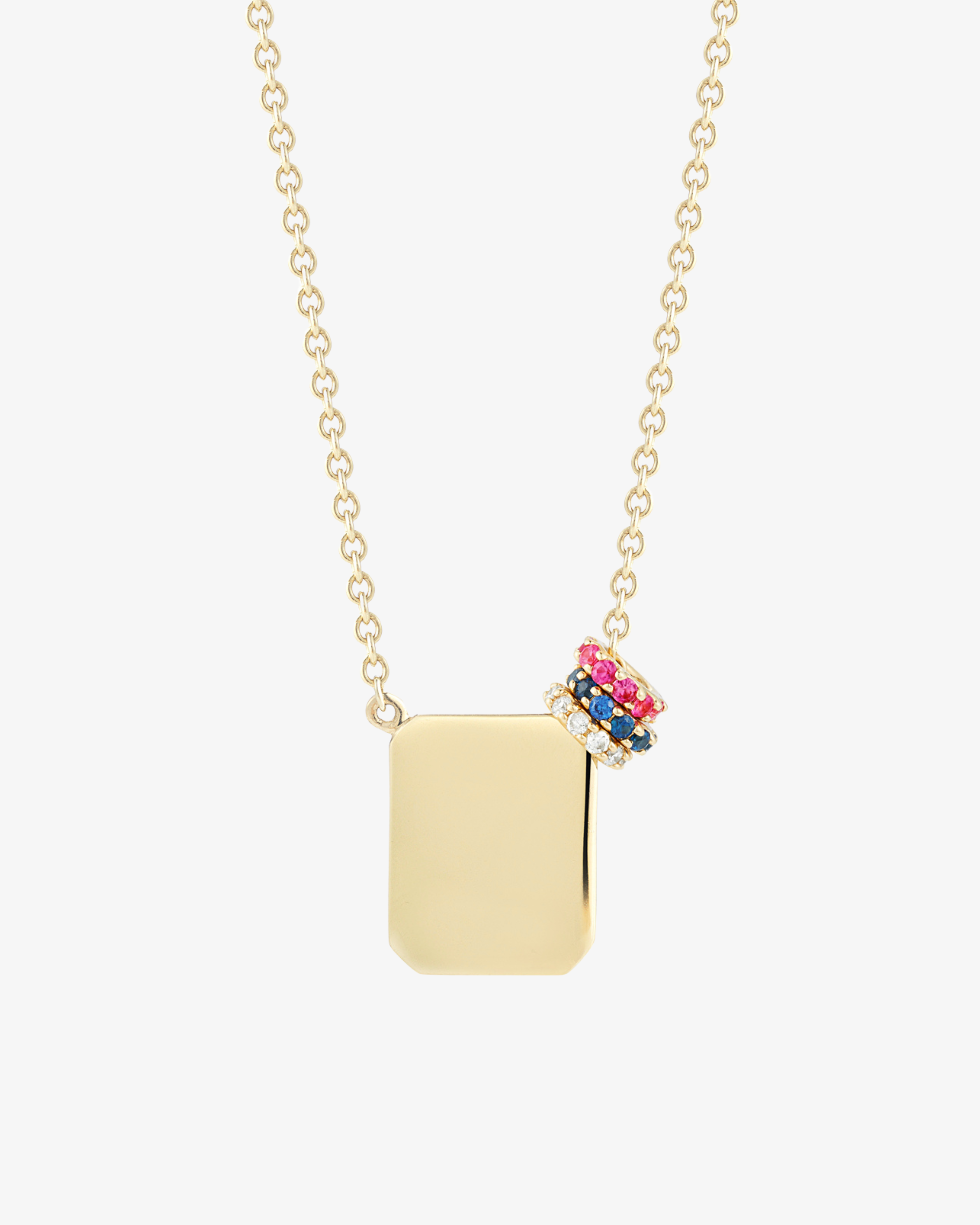 a gold tag necklace by love billy with a ruby halo charm, a diamond halo charm, and a sapphire halo charm.