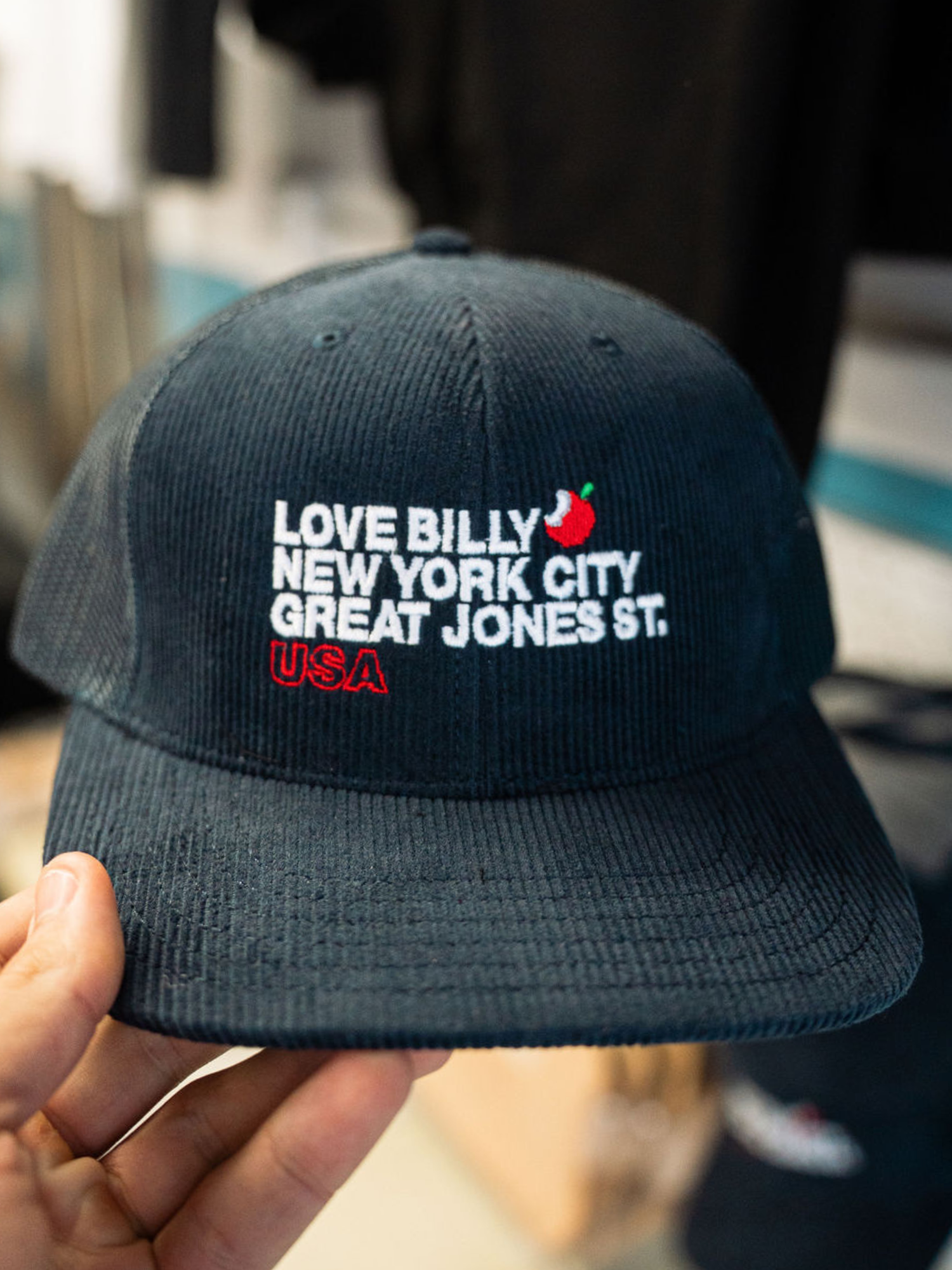 front of Love Billy Corduroy trucker hat embroidered with neighborhood graphic.