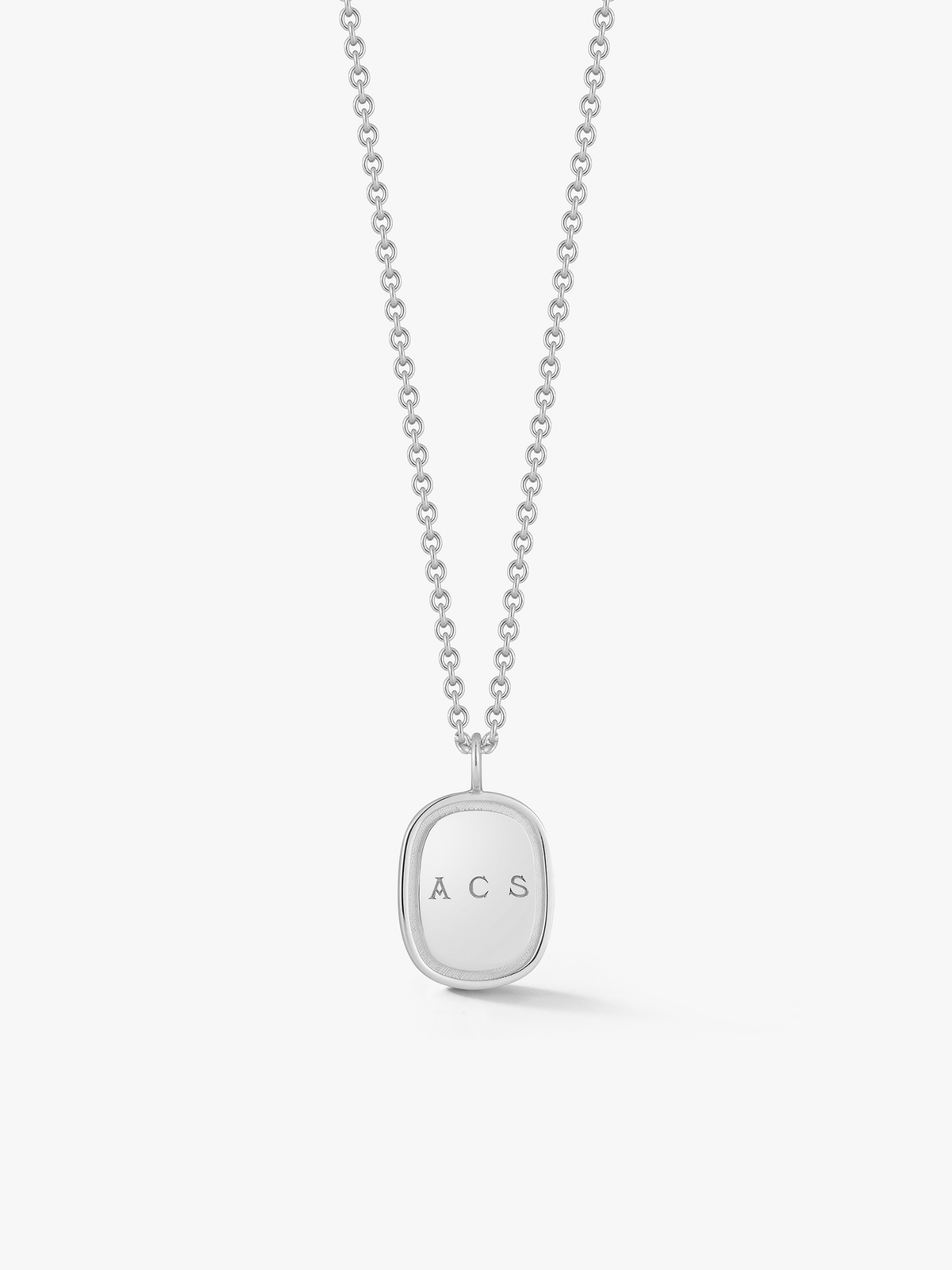 Small silver oblong pendant on a cable chain engraved with "ACS". Made by Love Billy.
