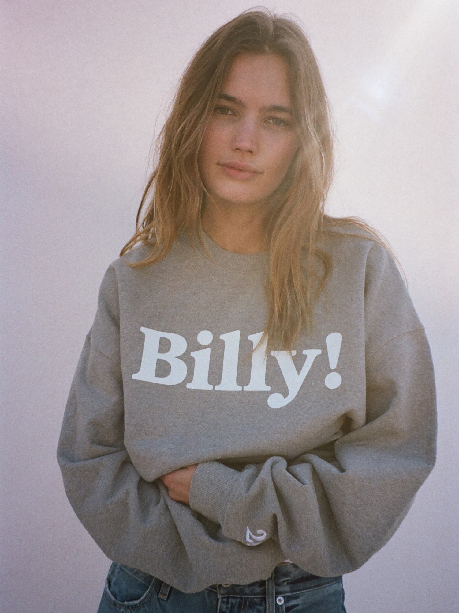 young girl with the heather grey crewneck unisex sweatshirt by love billy.
