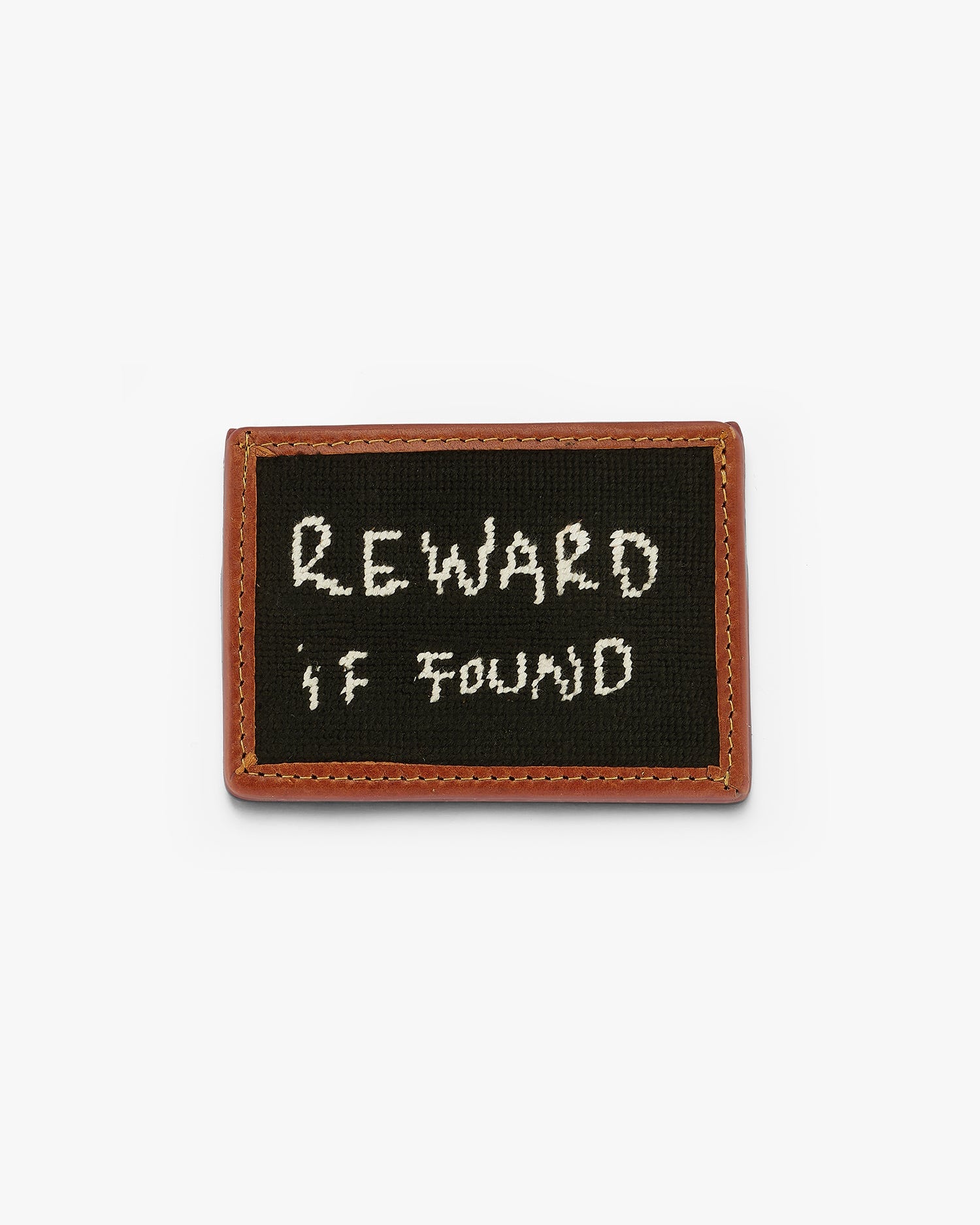 A Smathers & Branson custom engraved wallet reading "Reward if Found". Stitched by hand, vegetable dyed leather, 3 card slots and one center slot. Black engraving with white writing on brown leather. Love Billy.