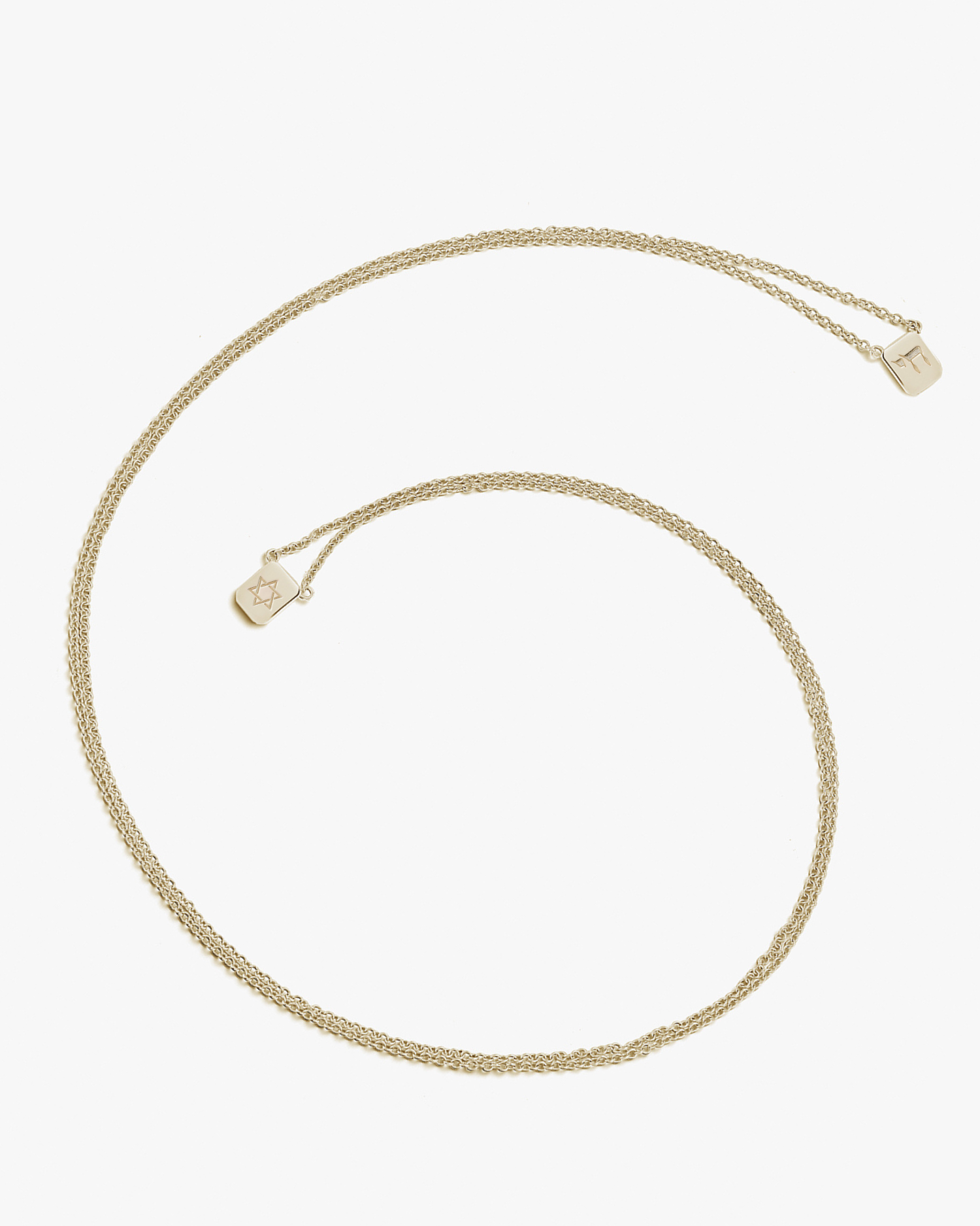 a love billy tag necklace engraved with a Star of David on one tag and a chai on the other tag