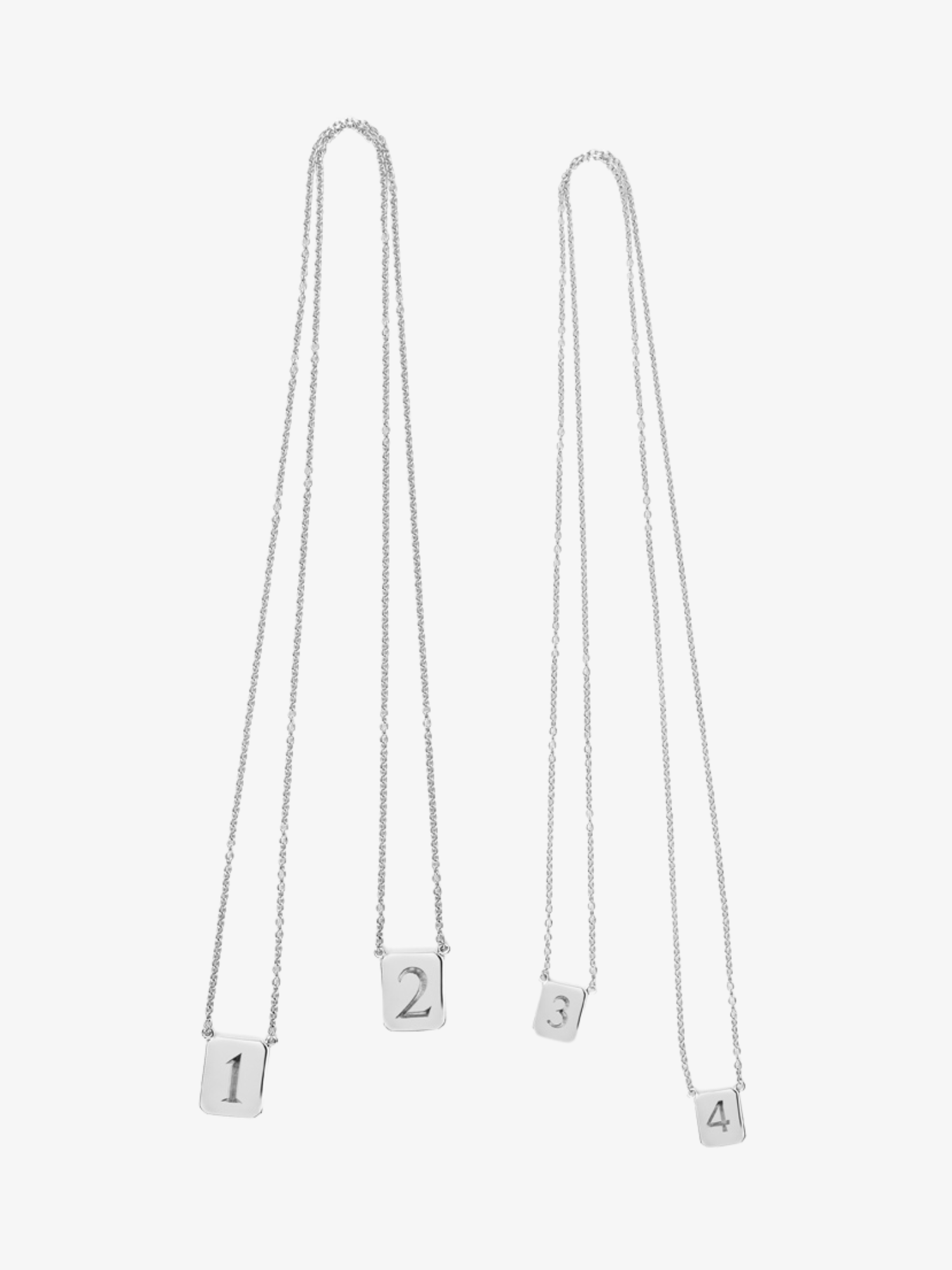 Two sets of the customizable Love Billy silver tag necklace.