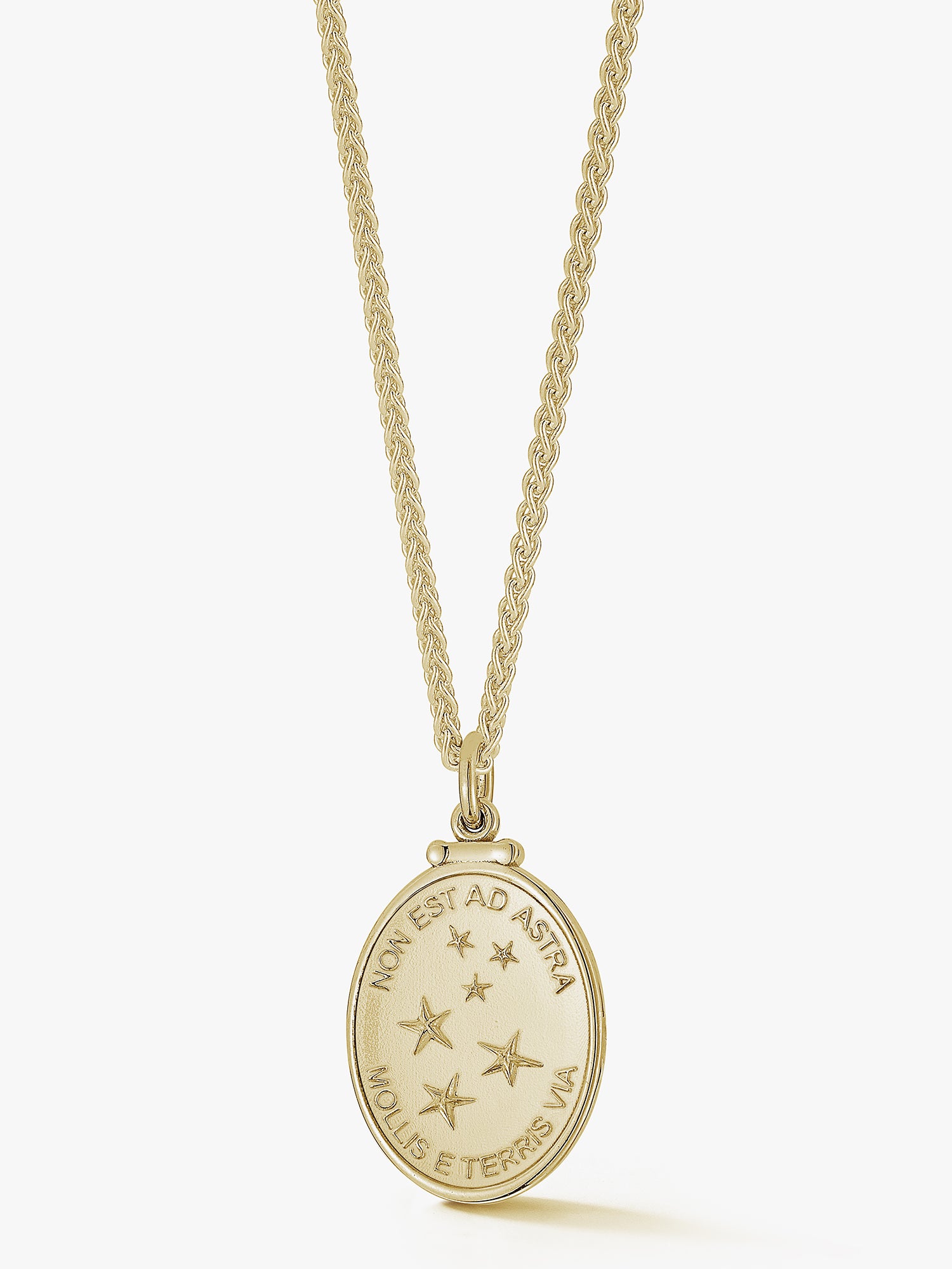 constellation pendant. a latin medallion that says "non est ad astra mollis e etrris via" a perfect gift for a stoic.