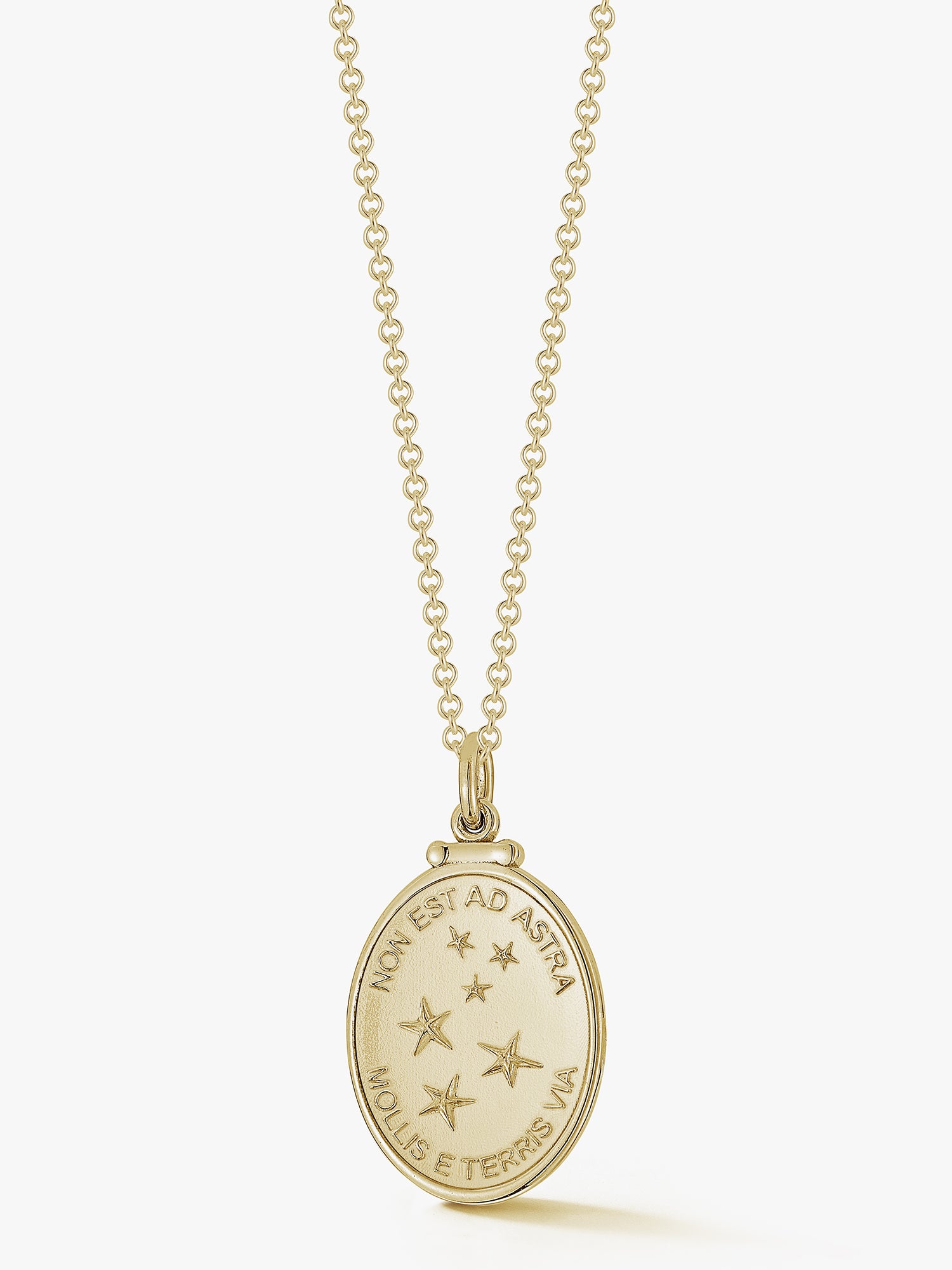 oval gold pendant with pattern of stars and latin phrase meaning the only way to the stars is from the earth by love billy.