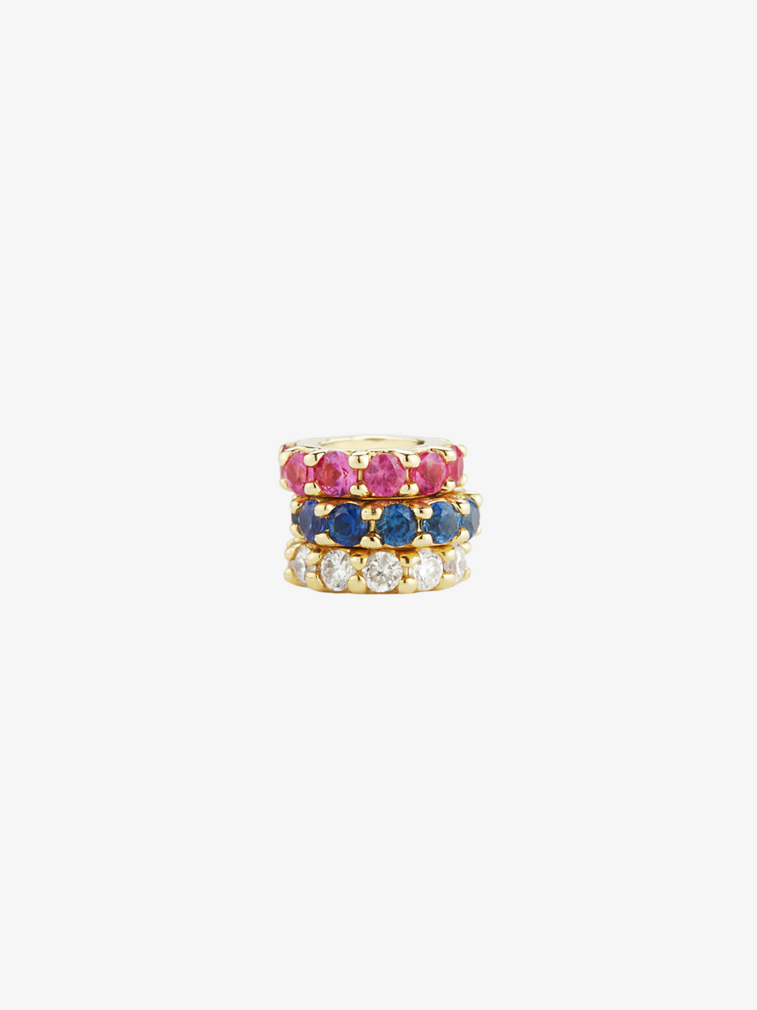 a stack of red, white, and blue jewelry. ruby halo, sapphire halo, and diamond halo