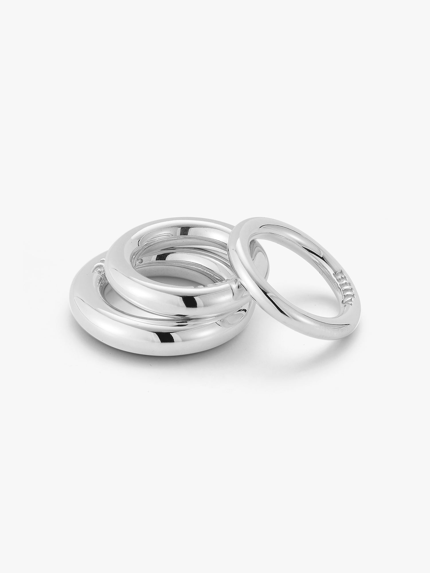 showing the jumbo, regular and mini carousel ring stacked on a white background