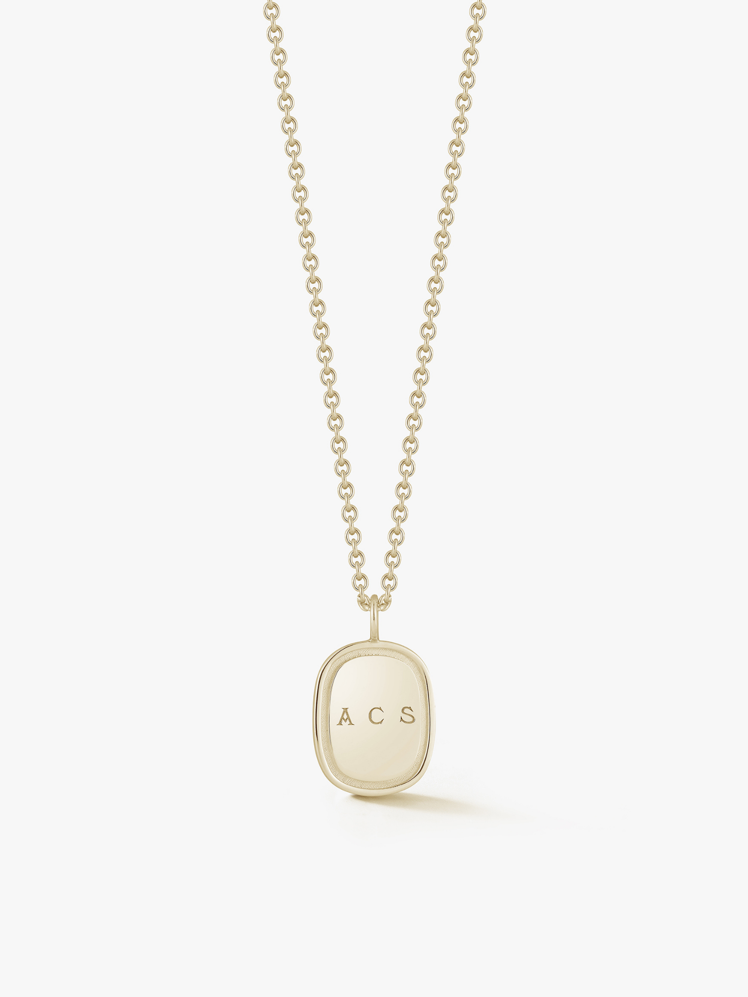 A gold-colored oblong pendant necklace with the initials 'AGS' on the pendant. Made by Love Billy. 