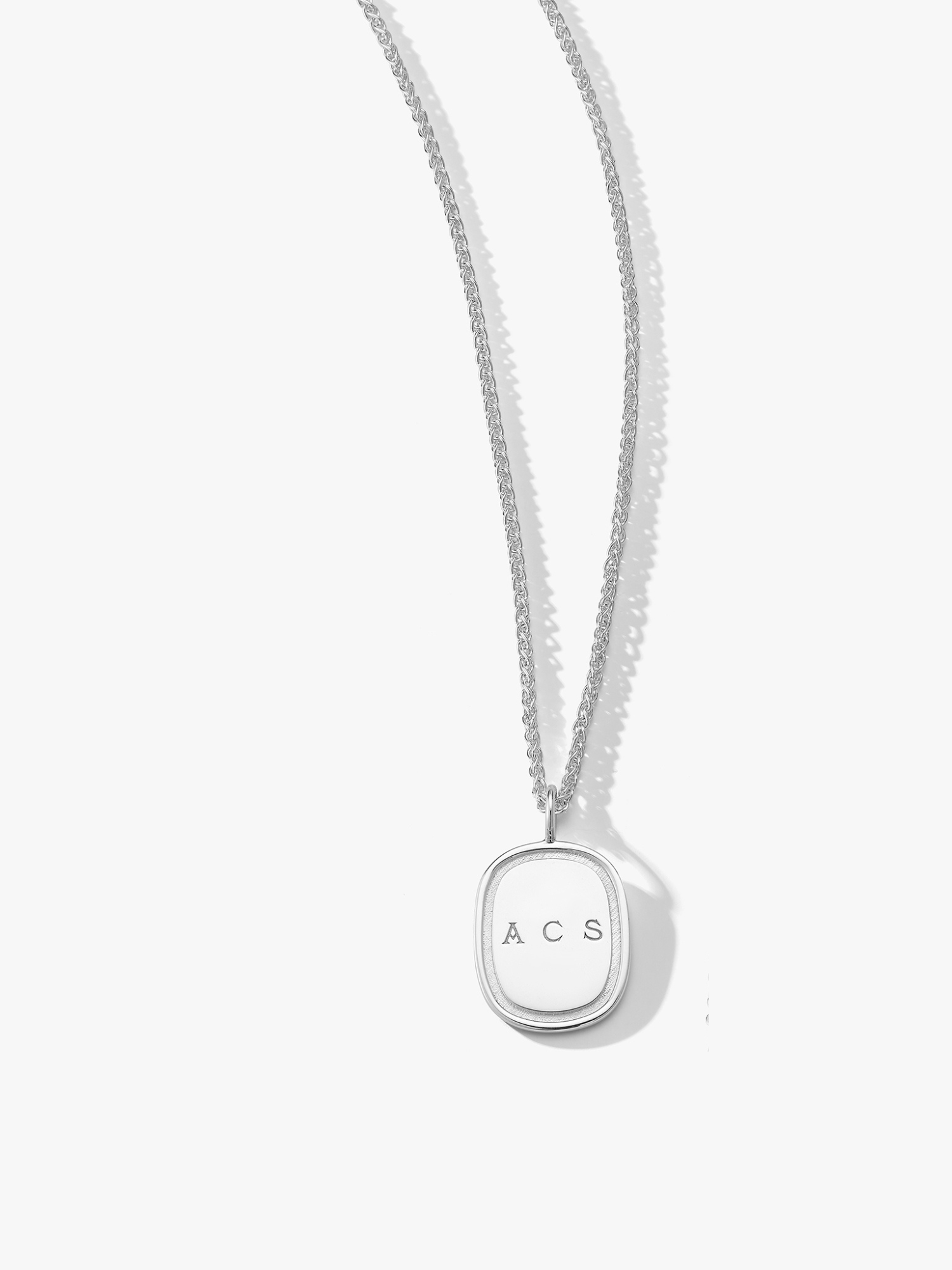 Large silver oblong pendant on a wheat chain engraved with "ACS". Made by love Billy in NYC. 