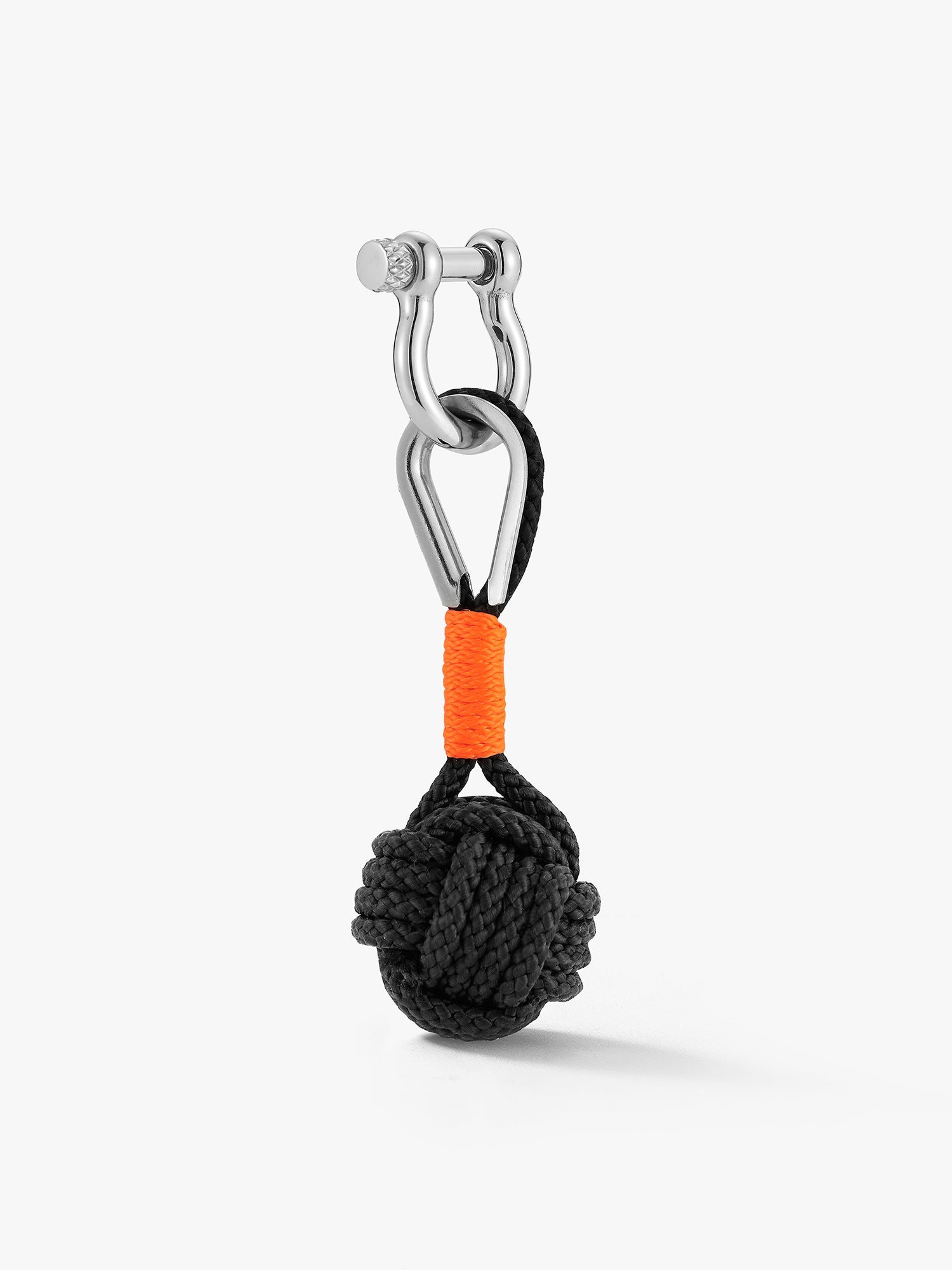 Black monkey fist charm keychain with orange accent. A very nice keychain. Hard to explain how satisfying the ball shape is to hold. It's made on Nantucket by a business so local there ain't no website or address. Shackle closure. Love BiIly NYC. 
