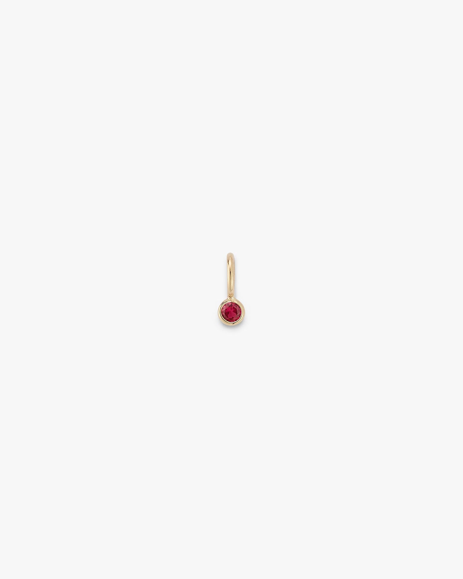 gold gemstone drop with a ruby 