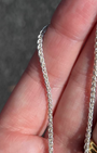 love billy silver wheat chain being held.